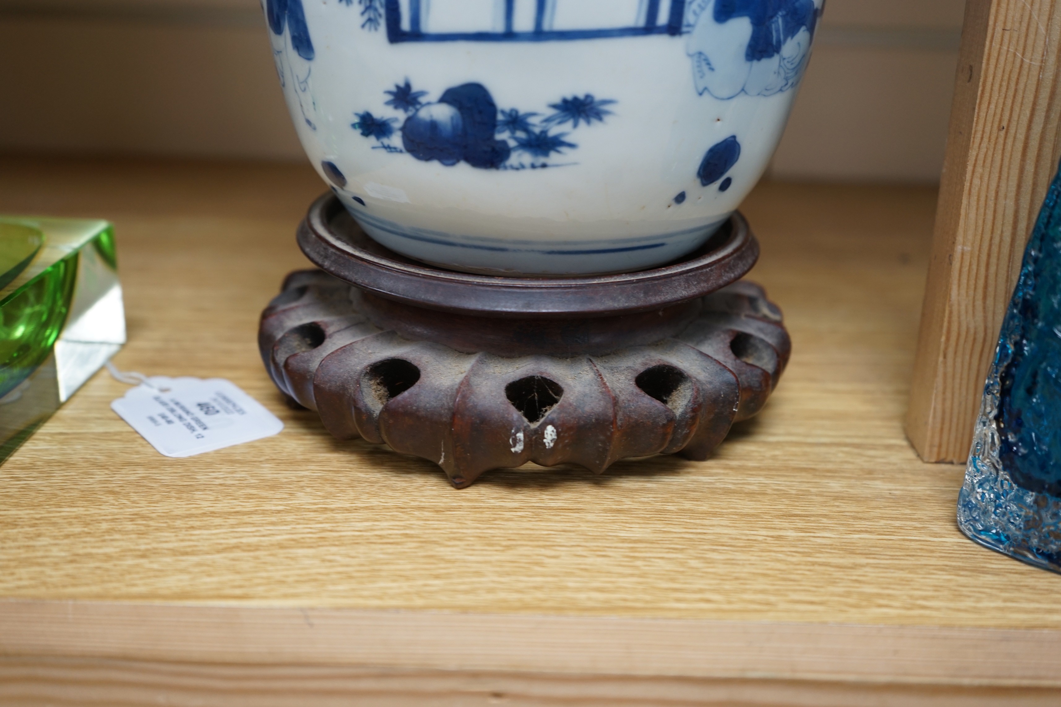 A Chinese blue and white 'boys' jar, 19th century, wood cover and stand, total height 24cm high